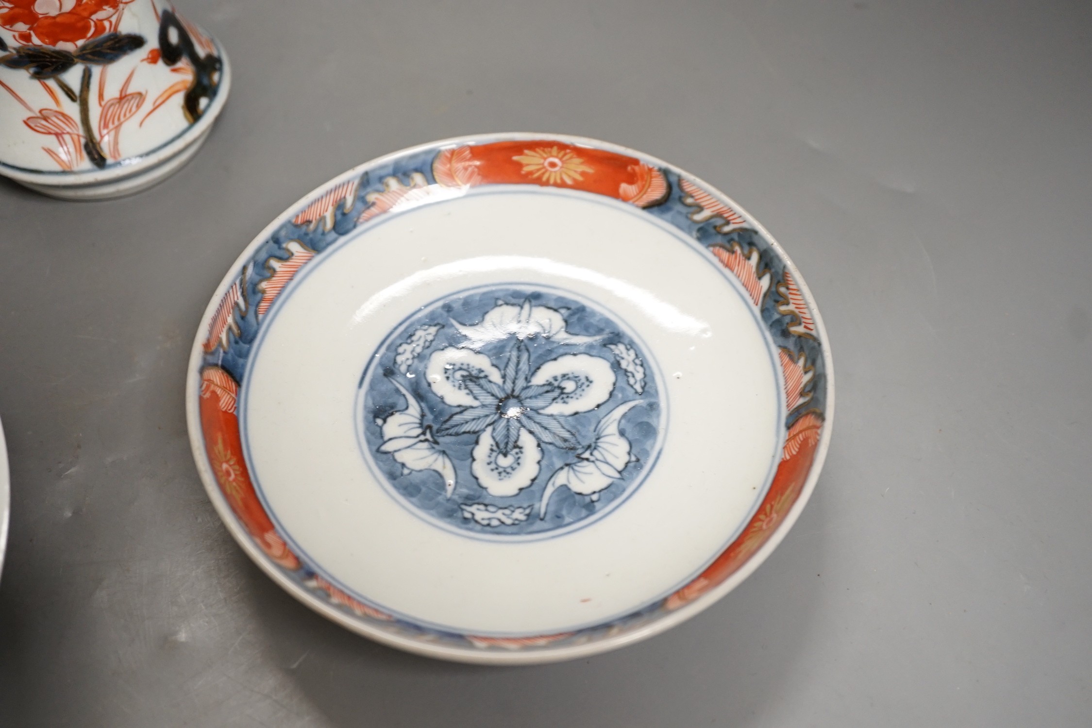 An 18th century Japanese Arita porcelain vase, a Nabeshima style dish and an Arita dish, height of vase 17cm